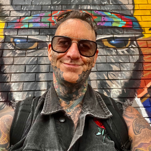 Miles Jackson in front of a graffiti wall