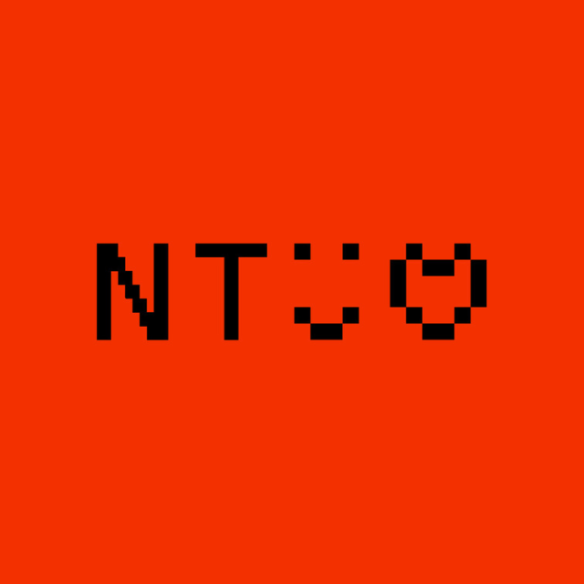 Red background with "NT" lettering, a smiley face, and a heart.