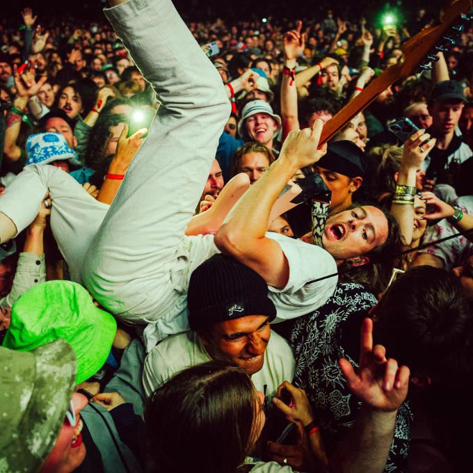 A guitarist jumped into the festival crowd at Splendour in the Grass